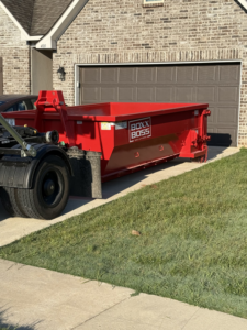 An empty dumpster being delivered or picked up by Boxx Boss Solutions for junk removal in Bossier City, LA.