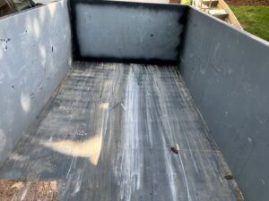 The clean interior of an empty 402 Container dumpster, ready for junk removal in Omaha, NE.