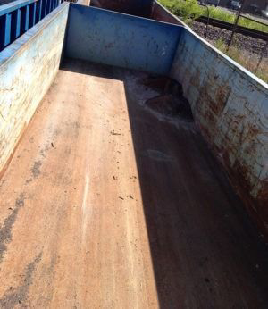 Inside view of an empty junk removal container from American Eagle Waste, serving Saint Louis, MO.
