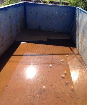 Interior view of an empty junk removal dumpster from American Eagle Waste in Saint Louis, MO, ready for use.