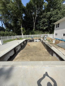 An empty pool shell undergoing renovation preparation by CDO Pool & Hot Tub Renovation in Norwalk, CT.