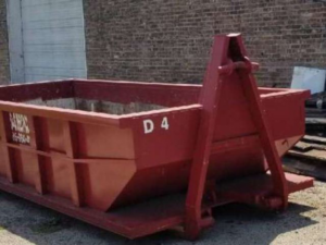 An empty red roll-off dumpster from SS ROLL OFF Dumpsters available for junk removal in Rockford, IL.