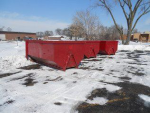 Two empty red roll-off dumpsters from SS ROLL OFF Dumpsters available for junk removal in Rockford, IL.