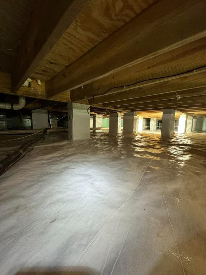 A newly encapsulated crawlspace with a white vapor barrier installed by Humidi-Seal Crawlspace Solutions in Charleston, SC.