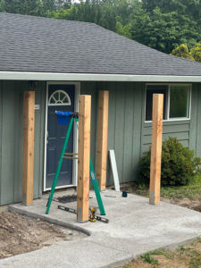 Wooden support posts installed for a new entryway structure by JJT Construction in Portland, OR.