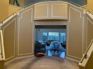 A grand entryway and staircase after remodeling with new paint and trim by VP Remodeling LLC in Duluth, GA.