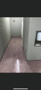 A durable epoxy flake floor installed in a commercial hallway by Kentucky Decorative Concrete in Nicholasville, KY.