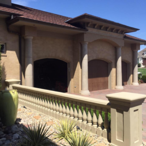 European style stucco and masonry exterior with columns and decorative fence by Old Style European Stucco & Masonry in Brentwood, TN