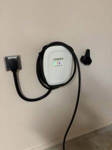 An Emporia EV charger professionally installed on a wall by Denali Electric LLC in San Antonio, TX