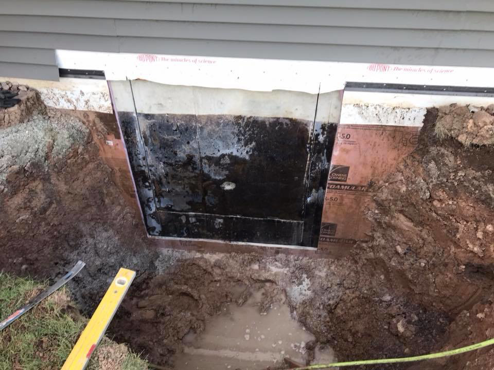 Excavation for an egress window well or foundation repair by Al Dorn Construction in De Pere, WI.