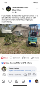 An excavator removing yard debris and bushes from a residential property by Alpha Environmental Services, LLC on Industrial Road.