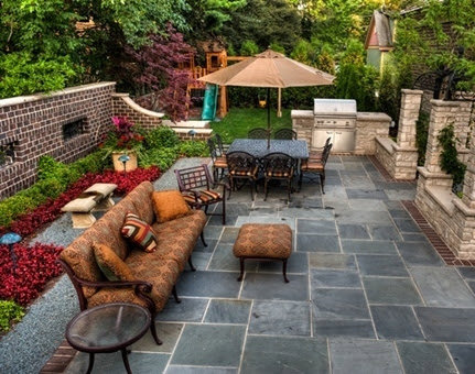 An expansive outdoor paver patio featuring a built-in grill and comfortable seating, installed by Landscape By Today in Bowie, MD.
