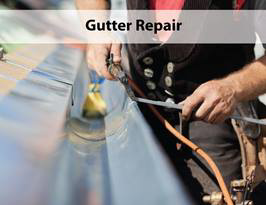 An expert performing gutter repair service by Legacy Decorative Rain Gutters in Colorado Springs, CO.