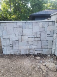 An expertly built stone retaining wall, showcasing masonry work by Gonzalez Services Corp. in Nashville, TN.
