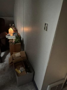 An exposed electrical outlet box on a wall, indicating electrical installation work by T-N-T Mechanical in Westland, MI.
