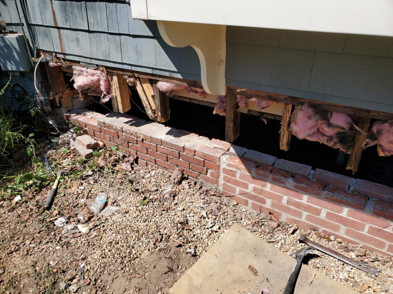 Exposed house foundation and sill area, prepared for rotted sill replacement by Richard C. Michalak in Worcester, MA.