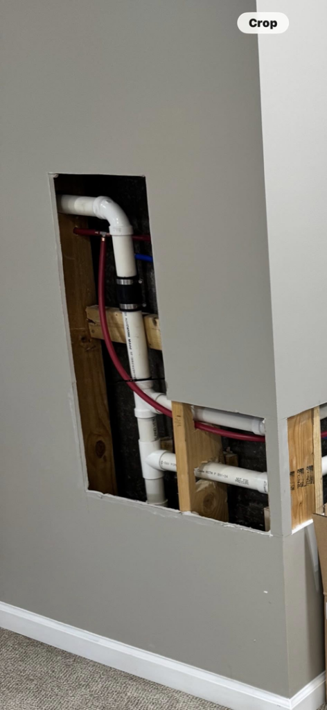 Exposed wall showing plumbing pipe installation in progress by Landsaw Craftsman & Co. in Richmond, KY.