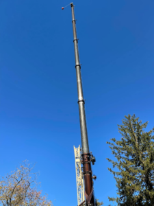 An extended crane boom, essential equipment for large tree removal services by Johnson Tree Services in Monrovia, CA.