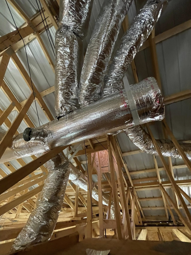 Extensive HVAC ductwork installation in an attic by ThermaPros in Leesburg, FL.