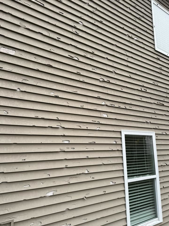 Extensive peeling paint on residential siding, indicating a need for exterior painting services from Larson Exteriors in Sunset Hills, MO.