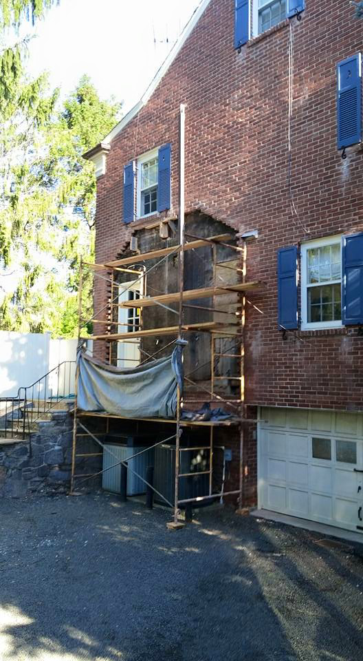 Exterior brick renovation with scaffolding on a house by Thomas J Stone GC in Yonkers, NY