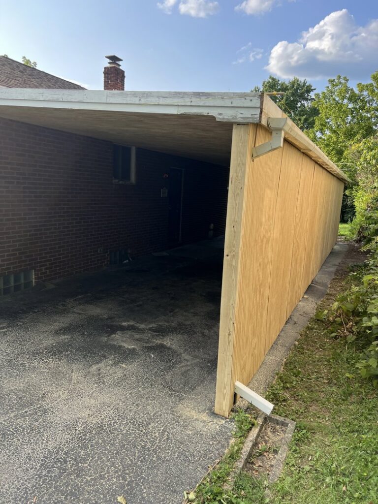 Exterior view of a carport renovation with new plywood siding by Jarrett's Home Improvements & Maintenance Services in Columbus, OH