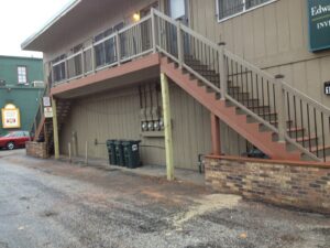 Exterior view of a building with new deck and stair construction by Pro Helping Hands Renovation in Colorado Springs, CO.