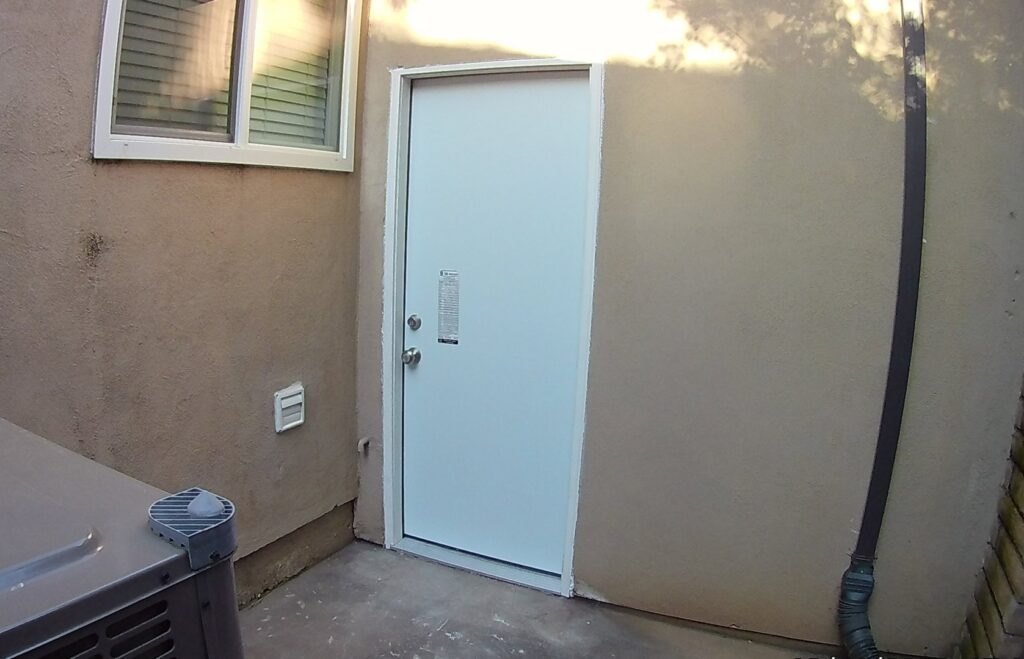 Exterior door installation in a stucco wall by Carpenter Joe's Handyman Service in Sacramento, CA