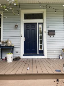 Exterior door and porch renovation with new paint and string lights by Mudd Brothers Contracting Co. in Pittsburgh, PA.