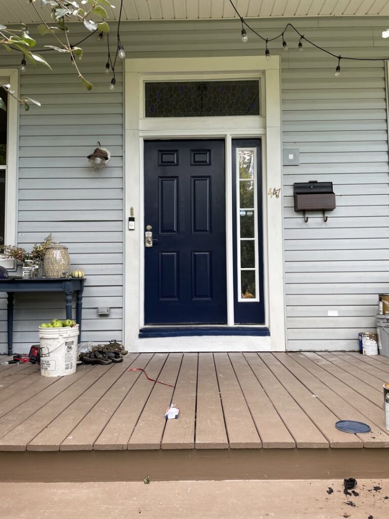 Exterior door and porch renovation with new paint and string lights by Mudd Brothers Contracting Co. in Pittsburgh, PA.