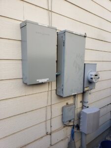 Exterior electrical meter and service boxes installed on the side of a building by Denali Electric LLC in San Antonio, TX