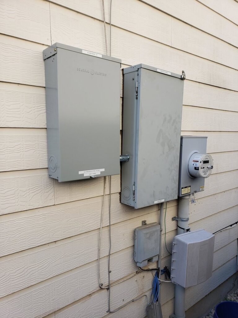 Exterior electrical meter and service boxes installed on the side of a building by Denali Electric LLC in San Antonio, TX