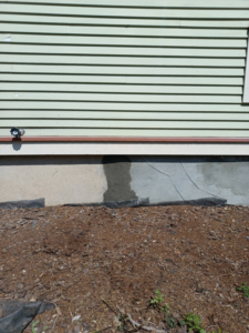 Exterior foundation repair and patching on a house by Clifton Jones Handyman service in South Elgin, IL