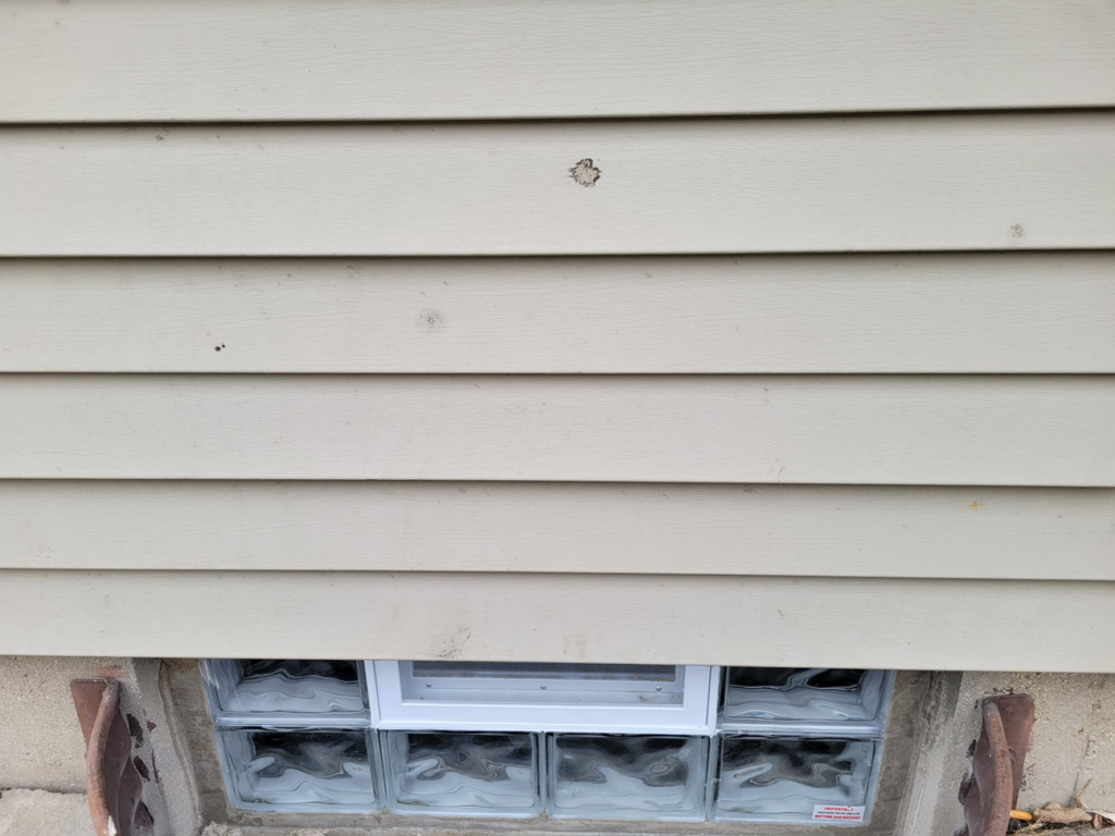 Exterior view of a newly installed glass block basement window by Phillips Home Improvements LLC in Philadelphia, PA.