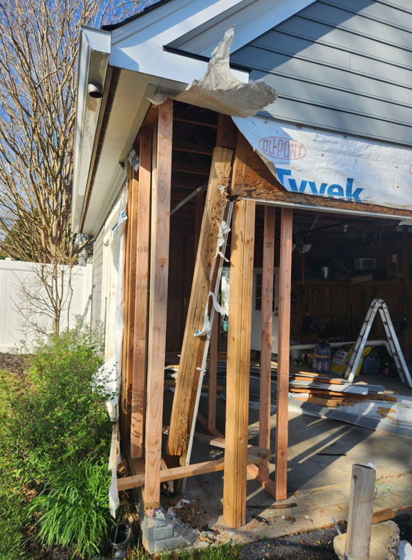 Exterior home renovation with exposed framing and Tyvek wrap by 4A Contracting and Home Improvement Specialists in Frederick, MD