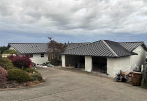 Exterior home renovation featuring a new metal roof and garage by Gregg Hoffman Construction Inc. in Tacoma, WA