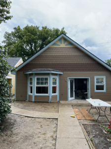 An exterior home renovation project featuring new siding and a bay window by Brother George Remodeling & Construction in Louisville, KY.