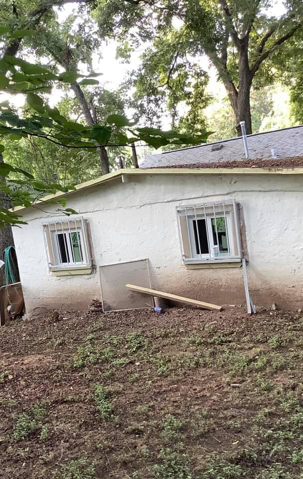 Exterior home renovation showing new windows and security bars installed by Valdez Remodeling & Weatherization Inc. in Austin, TX