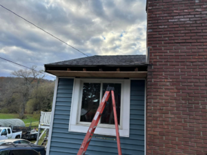 Exterior home repair in progress, showing exposed roof and soffit with a ladder, by GGS General Construction LLC in Plano, TX.