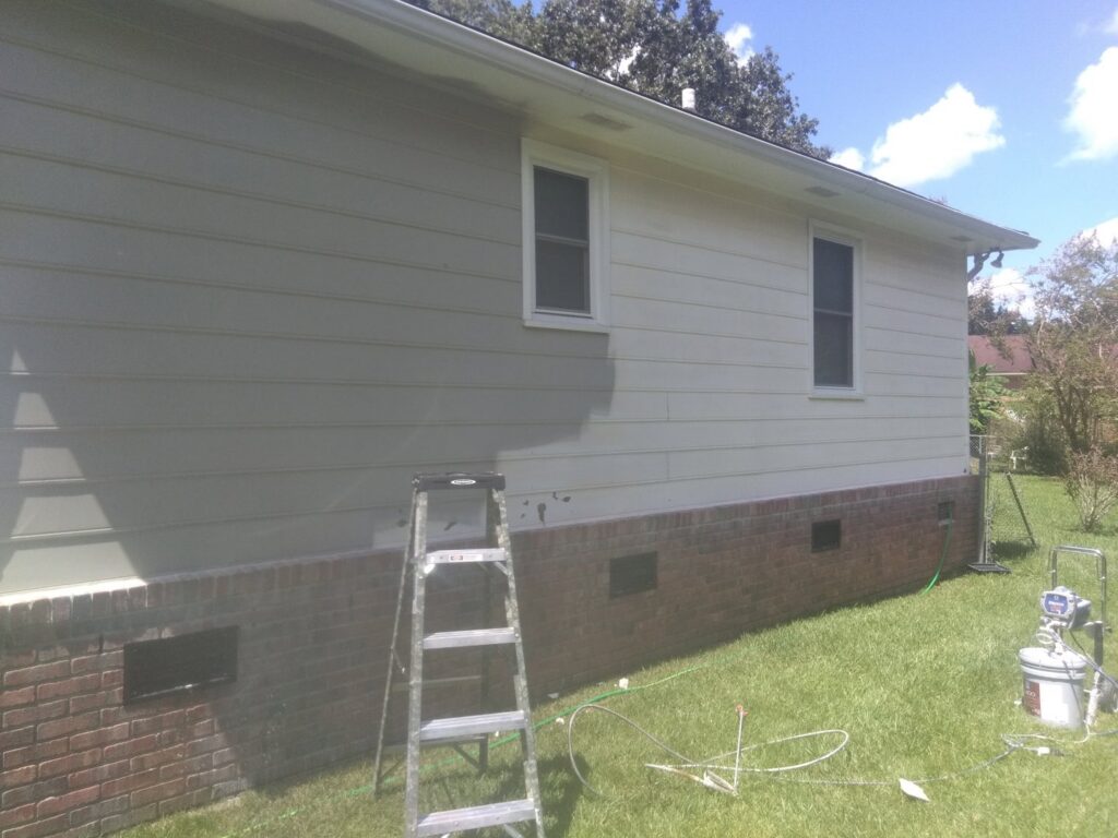 Exterior house painting in progress, a service by Holy City Remodel in North Charleston, SC.