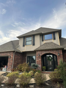 Exterior house renovation with window and siding work in progress by J&N Innovations LLC in Tulsa, OK.