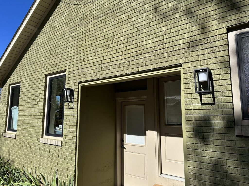 Newly installed exterior light fixtures on a brick house by I Know A Guy Handyman Service in Cottage Grove, MN.