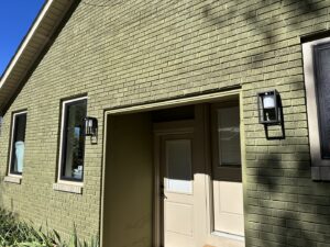 Newly installed exterior light fixtures on a brick house by I Know A Guy Handyman Service in Cottage Grove, MN.