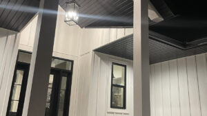 A newly installed exterior porch light fixture on a modern home by L12 Construction LLC in Oshkosh, WI.