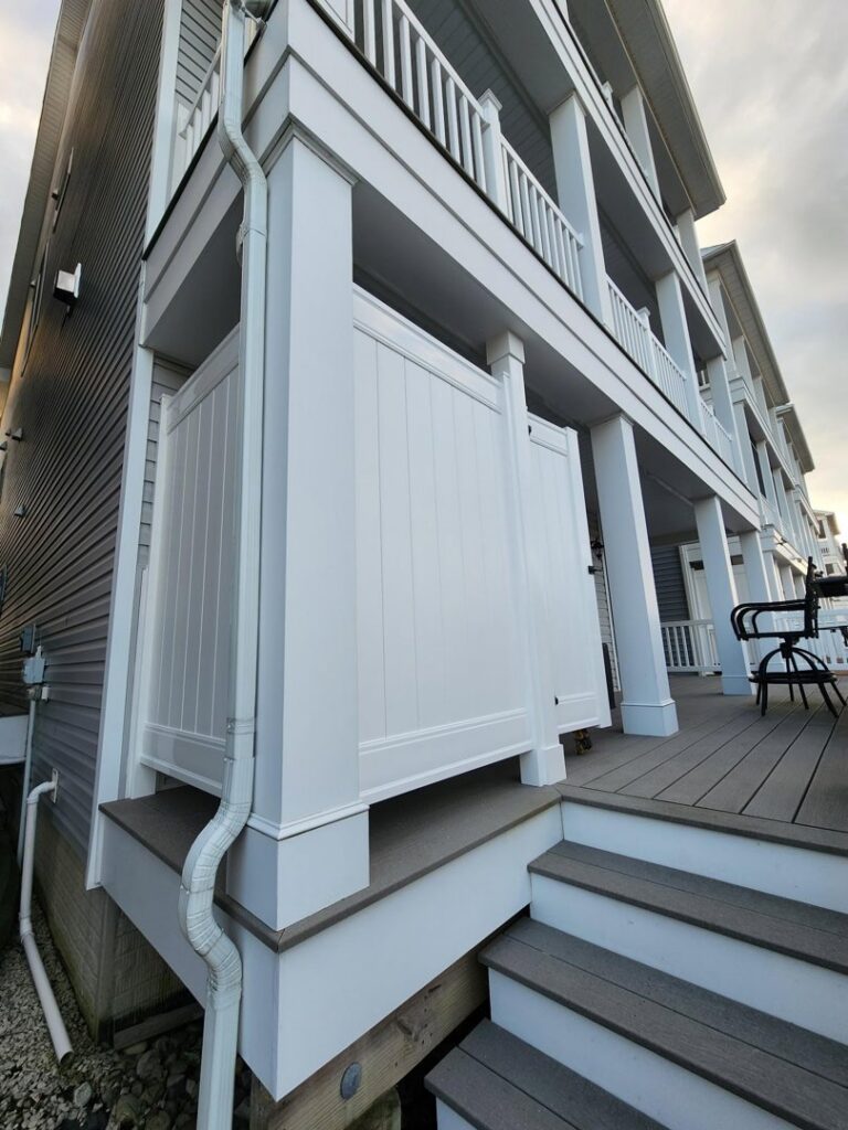 Newly installed exterior privacy screen and deck steps by Priority Property Services in Salisbury, MD.