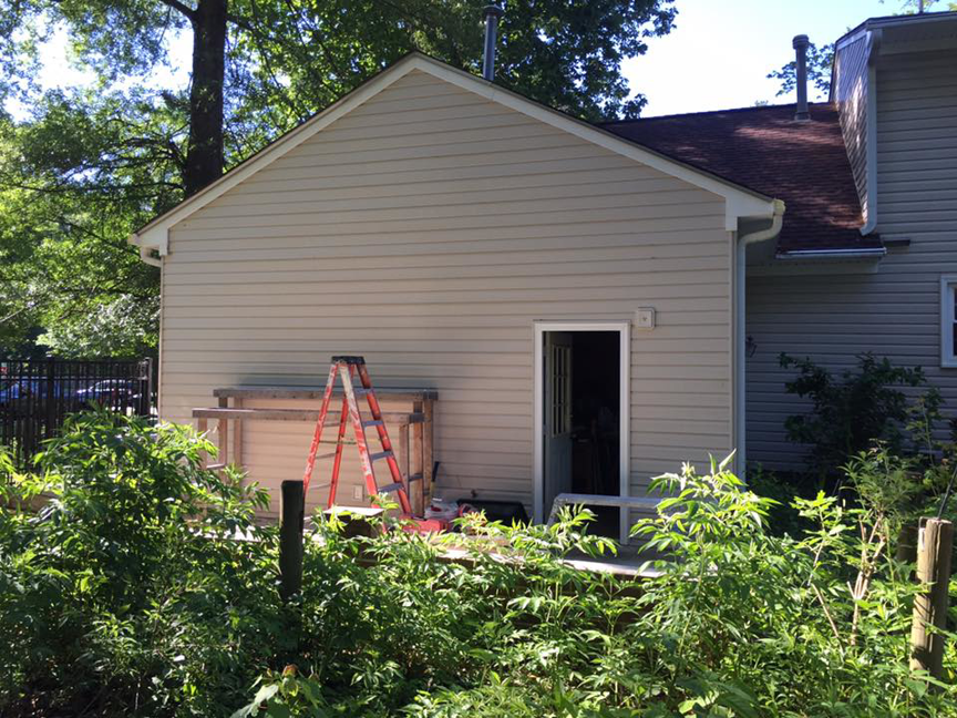 Completed exterior siding and a new home addition, demonstrating handyman services by Mason Home Improvement Inc. in Newport News, VA.