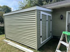 Exterior siding and shed construction project completed by Donald Home Improvements, llc in Milford, DE.