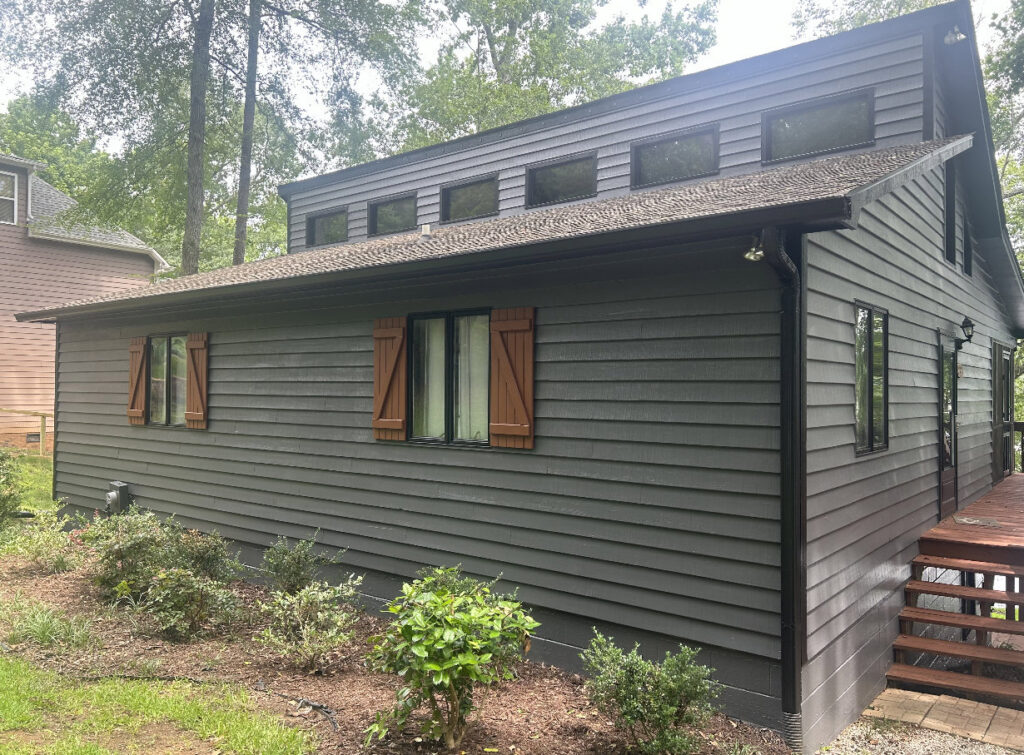 House exterior with new siding and decorative shutters installed by Lee's Painting in Northbrook, IL