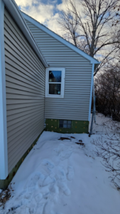 Exterior siding installation and foundation work on a house by Clausen Construction LLC in Williston, ND