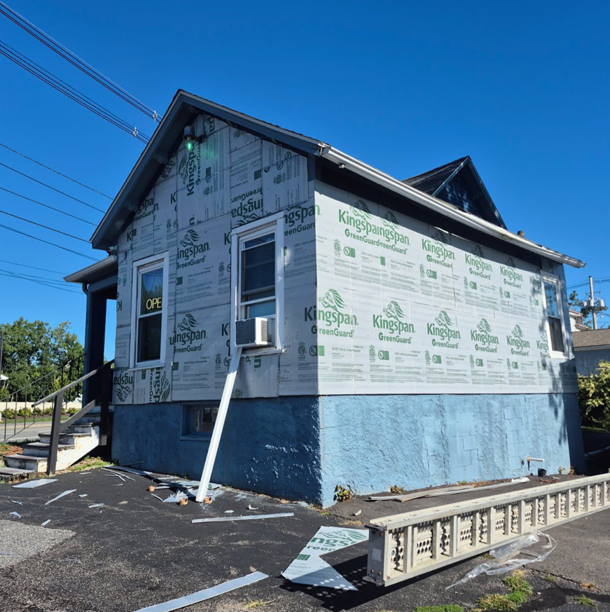 Exterior siding and insulation renovation in progress by Spotless & Handyman, LLC in Brockton, MA.